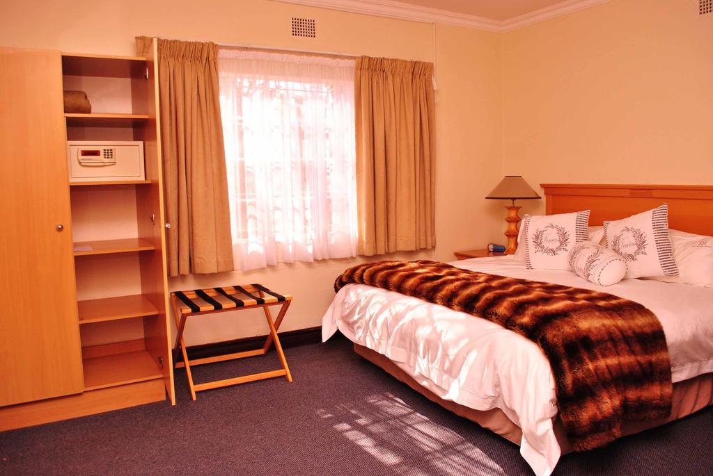 The George Hotel Manzini Habitación foto